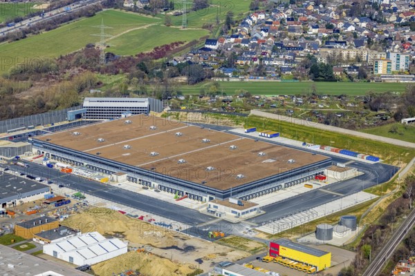 Aerial view, construction site new building Amazon logistics centre, industrial estate on