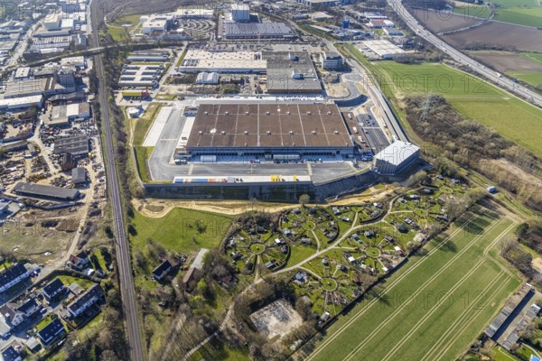 Aerial view, construction site new building Amazon logistics centre, industrial estate on