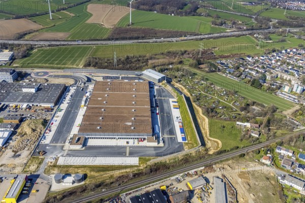Aerial view, construction site new building Amazon logistics centre, industrial estate on