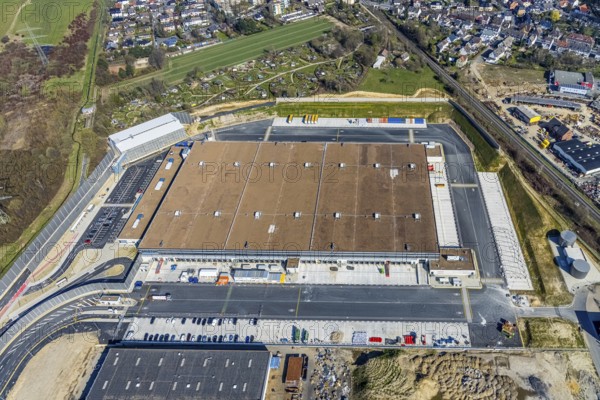 Aerial view, construction site new building Amazon logistics centre, industrial estate on