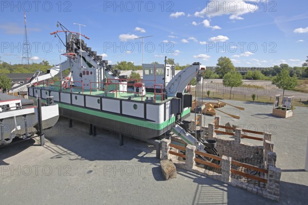 Historic dredging ship 'Otter' with shovels for dredging, open-air museum, machine, view from