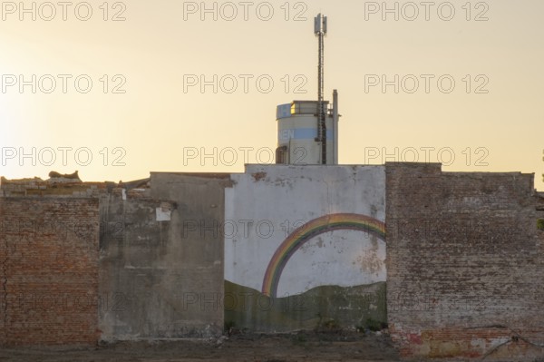 Photograph of a remaining wall of a demolished house in the evening light, Hanover, Lower Saxony,