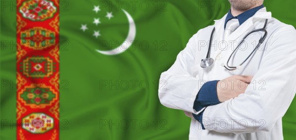 Turkmenistan healthcare concept. Male doctor on Turkmenistan flag. Doctor with crossed arms on
