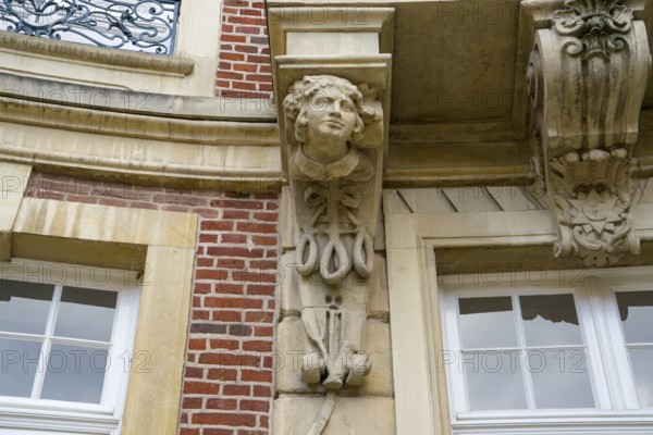 Traditional Westphalian Mettwurst sausage, detail on the facade of the Erbdrostenhof building,