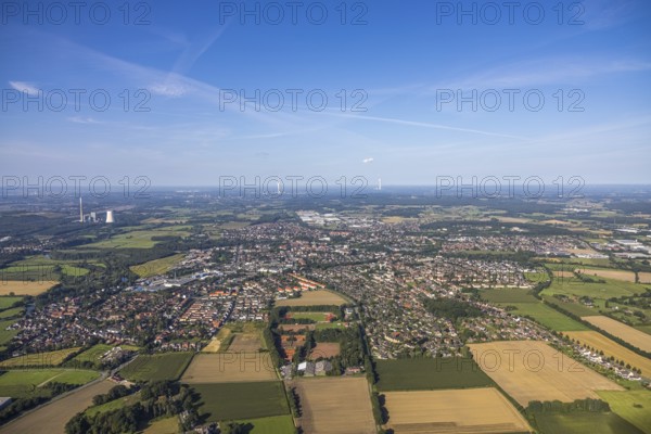 Aerial view of a town with surrounding fields and forest under a blue sky, aerial view Werl