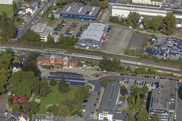 Aerial view, Schwelm railway station with red station building and bus station with solar roof and