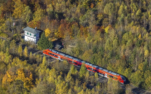 Aerial view, S-Bahn at a guard house in autumn forest in the district of Bigge in Olsberg,