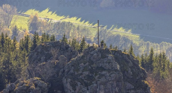 Aerial view, autumn forest and Bruchhauser Steine with summit cross in the district Bruchhausen in