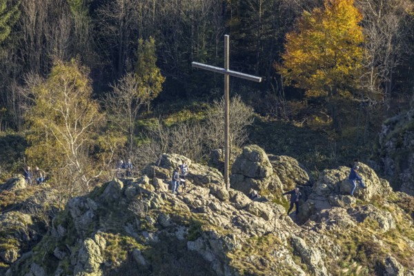 Aerial view, autumn forest and Bruchhauser Steine with summit cross in the district Bruchhausen in