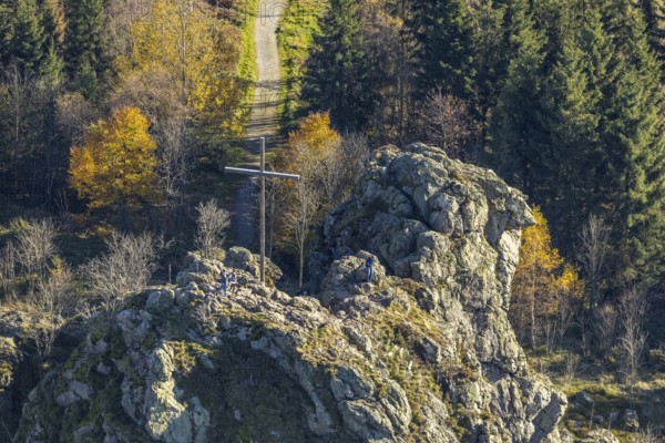 Aerial view, autumn forest and Bruchhauser Steine with summit cross in the district Bruchhausen in