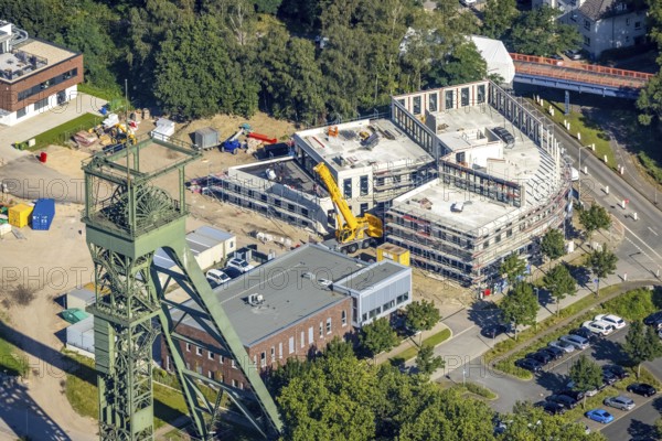 Aerial view, winding tower and Steigerhaus as well as construction site and new building at