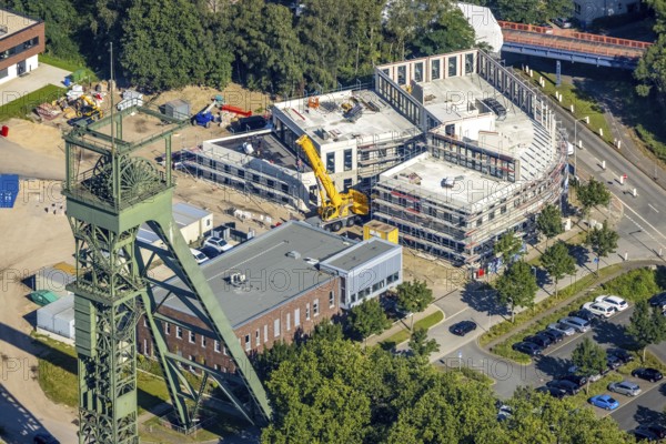 Aerial view, winding tower and Steigerhaus as well as construction site and new building at
