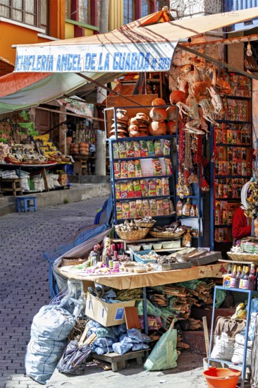 A stall at an Andean market with spices and colourful packaging, traditionally decorated, The