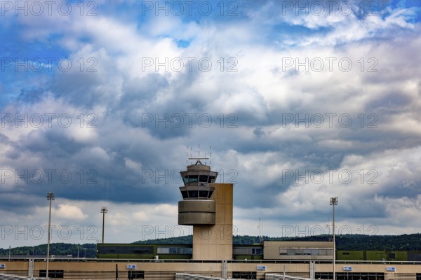 Air Traffic Control Tower on the Airfield in a Sunny Summer Day with Blue Sky and Clouds From the
