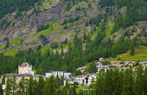 Luxury Hotel in the Forest with Mountain View in the Swiss Alps in a Sunny Summer Day in