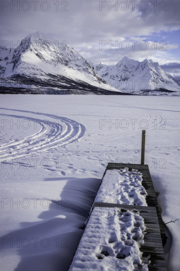 Norway tromsö snow mountains lake jetty frozen