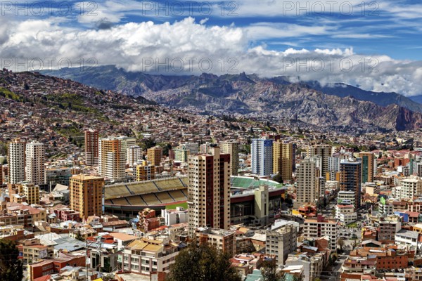City view with skyscrapers and mountain landscape in the background, The houses and skyscrapers of