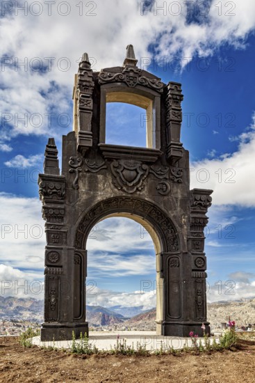 An imposing stone gate with fine details under a dramatic cloudy sky, The gate at the Killi Killi