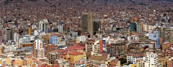 Dense urban development of La Paz with many buildings under a clear sky, The houses and skyscrapers