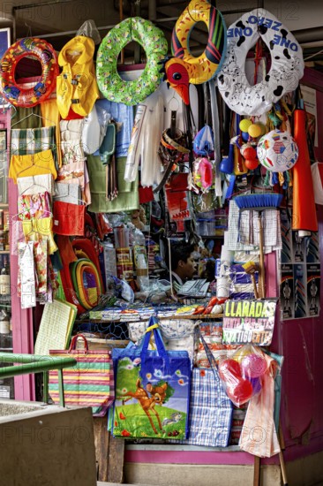 Colourful stall full of toys and colourful objects at a lively market, Small shops and restaurants