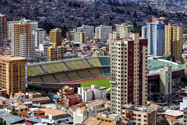 Cityscape with a large stadium surrounded by skyscrapers, The houses and skyscrapers of the city
