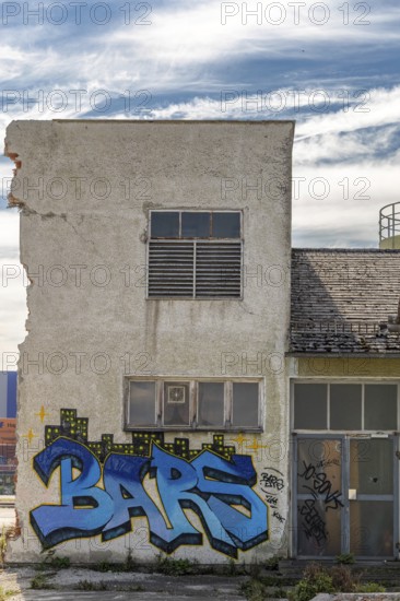 Graffiti with the word Bars on a dilapidated, urban building, at the harbour Linz Upper Austria