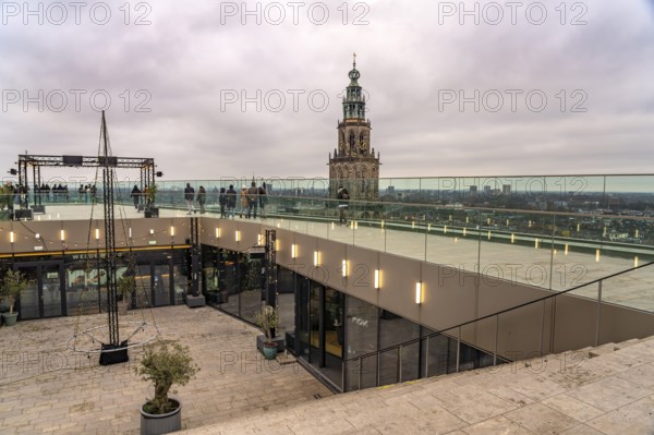 Roof terrace of the Forum Groningen and the Martinitoren church tower of the Martinikerk or Martini
