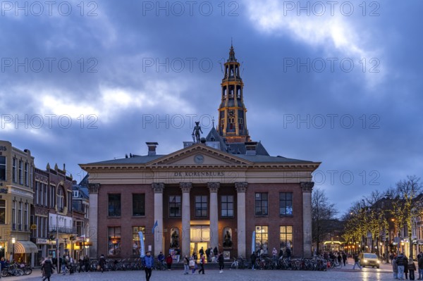 The Vismarkt fish market with the Korenbeurs former grain exchange and the steeple of the Aa church
