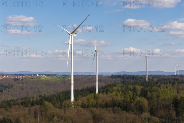 Wind turbines in a hilly, wooded area under a clear sky, maintenance work, repair, near Schorndorf