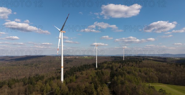 Wind turbines in a wooded area under a blue sky, maintenance work, repair, near Schorndorf im