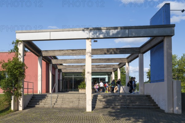 Teenagers leaving the indoor swimming pool, Aqua Riese, Bad Staffelstein, Upper Franconia,