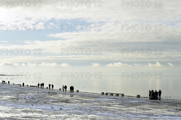 North Sea coast, view to the beach promenade of Norddeich, Wadden Sea with rising water and calm