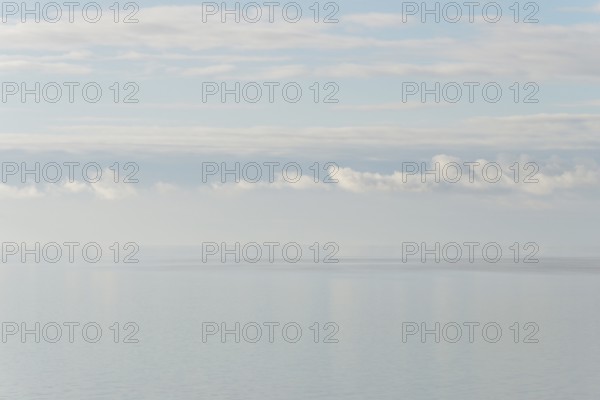 North Sea coast, special light atmosphere over the Wadden Sea with rising water and calm wind,