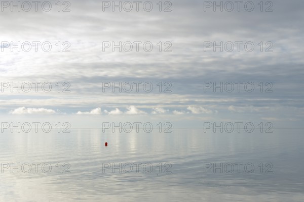 North Sea coast, special light atmosphere over the Wadden Sea with rising water and calm wind, red