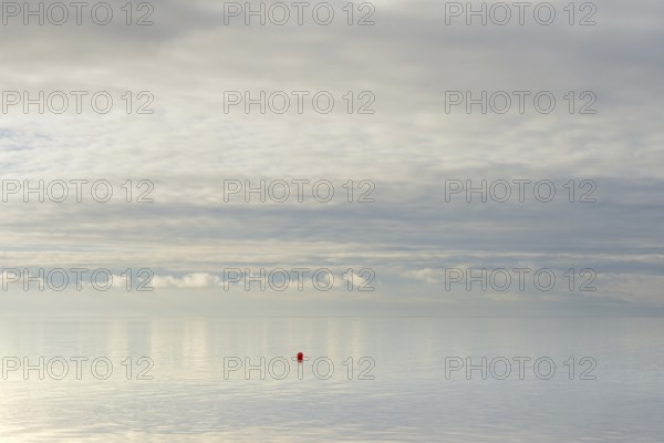 North Sea coast, special light atmosphere over the Wadden Sea with rising water and calm wind, red