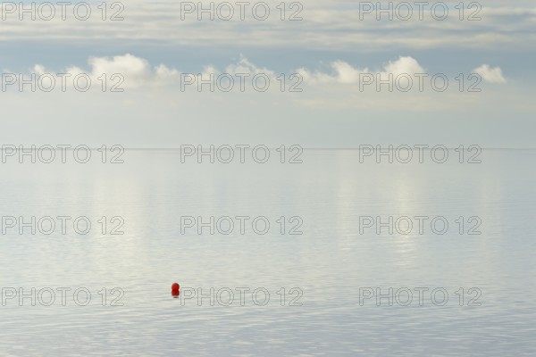 North Sea coast, special light atmosphere over the Wadden Sea with rising water and calm wind, red