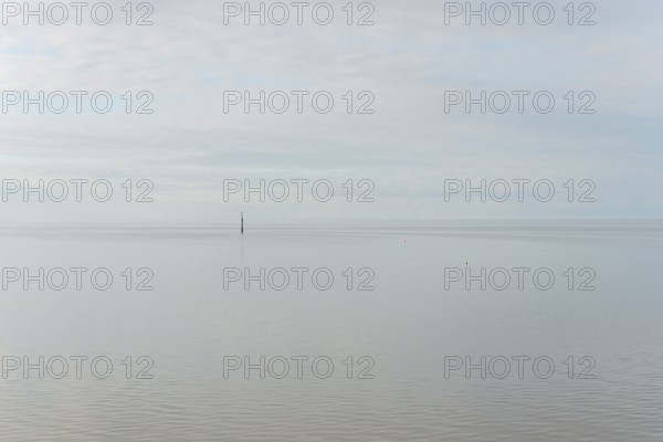 North Sea coast, special light atmosphere over the Wadden Sea with rising water and calm wind,