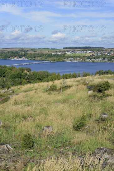 View over the Möhnesee, Körbecke village with the lake park and the lakeside promenade, blue cloudy