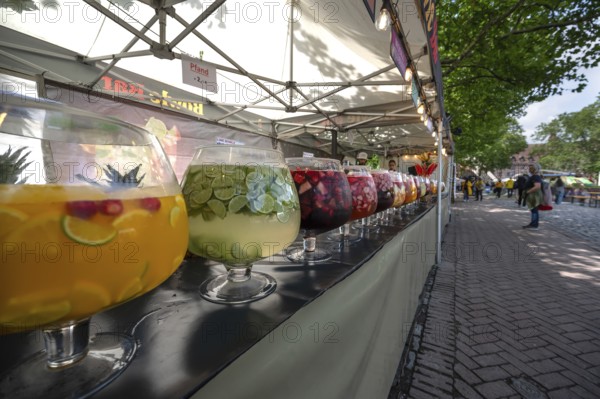 Large glasses filled with punch, market stall at the city festival, Nuremberg, Middle Franconia,