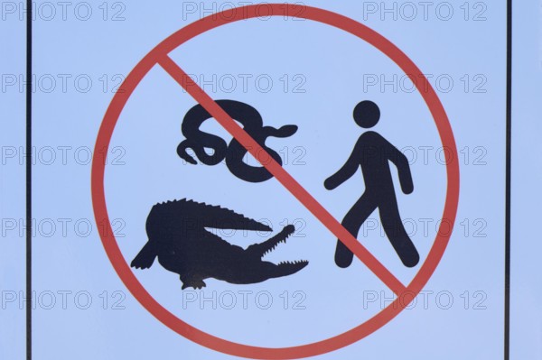 Prohibition sign with images of a snake, a crocodile and a person, Flamingo, Marina, Everglades