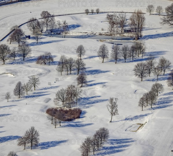 Aerial view, heart-shaped bushes in a winter landscape in the golf course of Raffelberg racecourse,