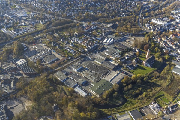 Aerial view, industrial estate Am Törnigskamp and cath. Heilig Kreuz Kirche in Menden, Sauerland,