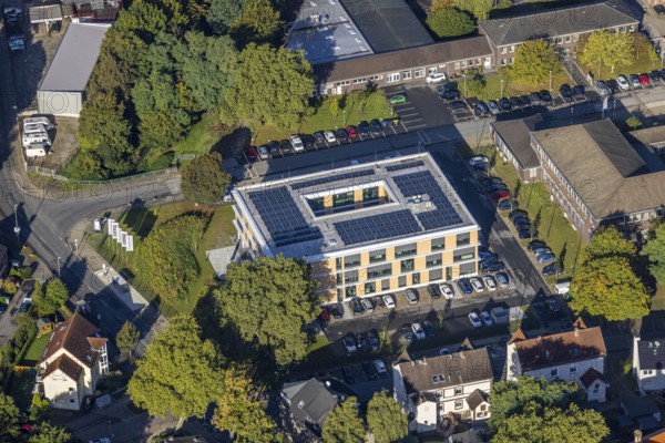 Aerial view, new building with solar roof of the company headquarters of the Heitkamp Group on the