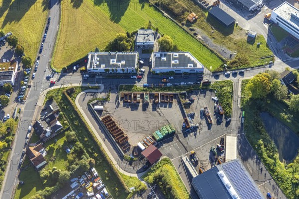 Aerial view, steel company building with solar roof opposite the recycling centre in the district