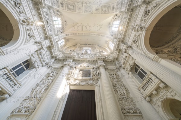 View of the richly decorated ceiling of a baroque church with architectural details, Munich,