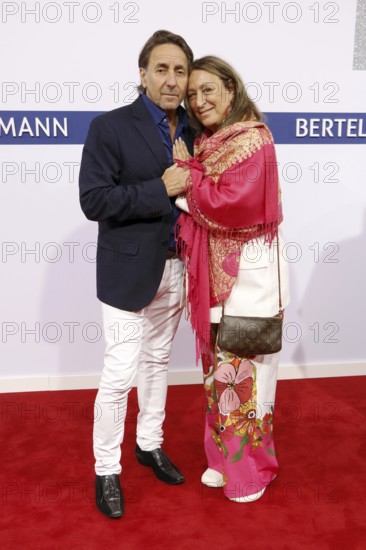 Dieter Landuris and his woman Natascha Landuris arriving at the Bertelsmann Summer Party 2025 at
