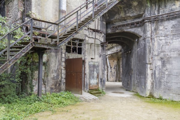 Rotten industrial architectural scenery including a rundown stairway