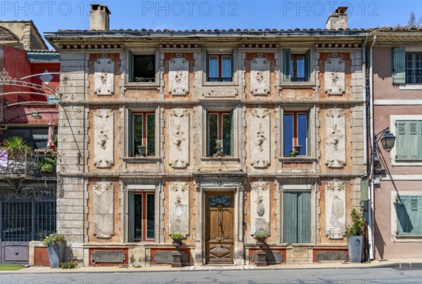 House facade in Fontaine-de-Vaucluse, a commune near a same named spring in the southeastern French