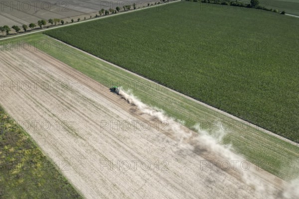 Field work, tractor, ploughing, cultivating, sowing peas, fertilising, dryness, drought,
