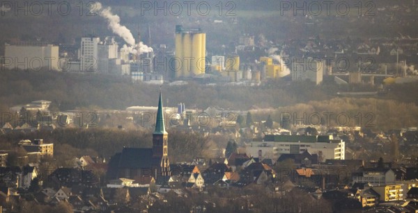 Aerial view of St. Pancratius Church with a view of the harbour and the Jäckering Group mill in